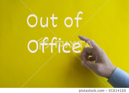 Out of office text on yellow cover background. Business and out of office concept 91814188
