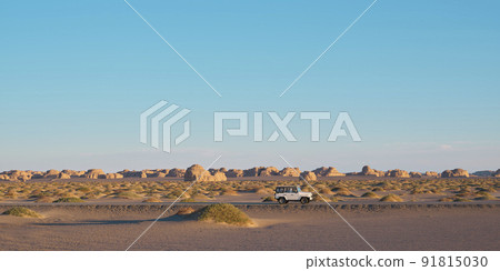 vehicle on the road in national geological park in dunhuang, gansu province, china vehicle on the road in national geological park in dunhuang, gansu province, china 91815030