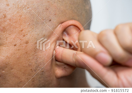 A man who plugs an ear A man who plugs an ear 91815572