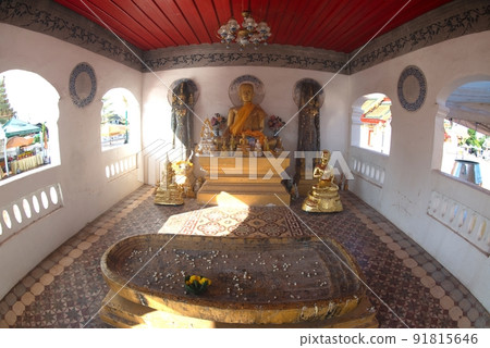 Group of ancient Buddha images, including standing Buddha images, sitting Buddha images and the footprint of the Buddha enshrined inside the Wat Phra That Choeng Chum Worawihan It is an important. Group of ancient Buddha images, including standing Buddha images, sitting Buddha images and the footprint of the Buddha enshrined inside the Wat Phra That Choeng Chum Worawihan It is an important. 91815646