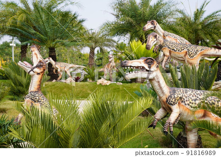 light colour Dinosaur statue in the garden. It's ChiangRai province, North of Thailand. light colour Dinosaur statue in the garden. It's ChiangRai province, North of Thailand. 91816989