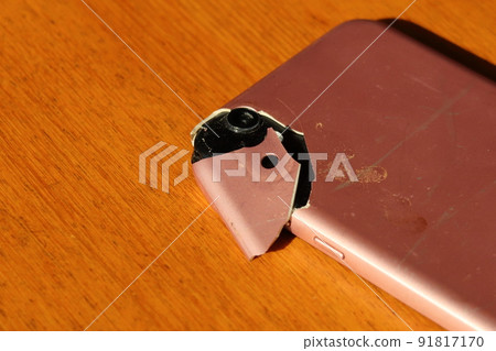 Cracked smartphone exterior Cracked smartphone exterior 91817170