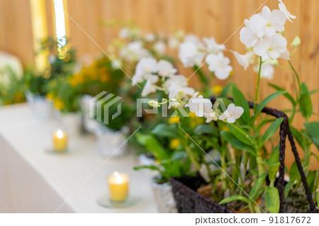 flowers decorate on the dinning long table in the luxury relax event with the wood plate background. flowers decorate on the dinning long table in the luxury relax event with the wood plate background. 91817672