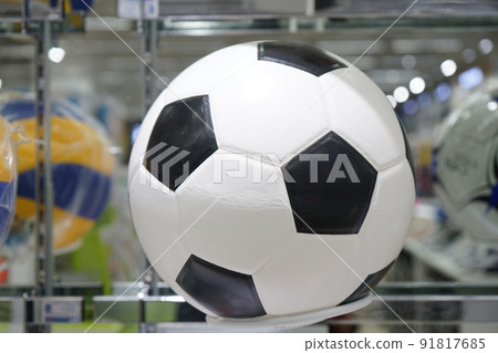 Football ball on the shelf for sales in the sports shop. Football ball on the shelf for sales in the sports shop. 91817685