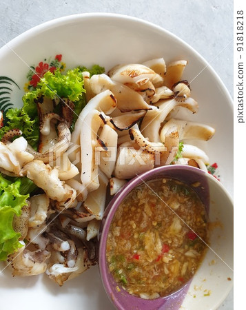 Grilled squid or octopus at Thai seafood market Grilled squid or octopus at Thai seafood market 91818218