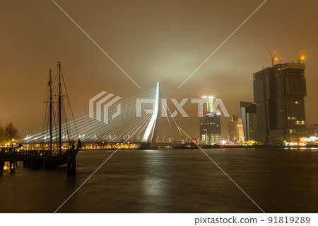 Illuminated Erasmus Bridge and Nieuwe Maas River in Holland Rotterdam Illuminated Erasmus Bridge and Nieuwe Maas River in Holland Rotterdam 91819289