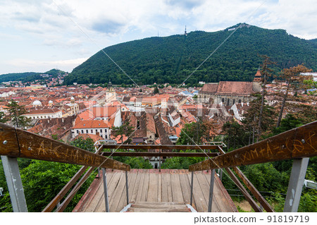 The cityscape of the old town, the black church and Mt. Tumpa seen from the white tower of Brasov in Transylvania, Romania The cityscape of the old town, the black church and Mt. Tumpa seen from the white tower of Brasov in Transylvania, Romania 91819719