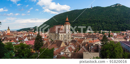The cityscape of the old town, the black church and Mt. Tumpa seen from the black tower of Brasov in Transylvania, Romania The cityscape of the old town, the black church and Mt. Tumpa seen from the black tower of Brasov in Transylvania, Romania 91820016