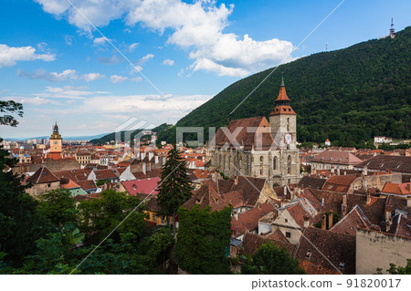 The cityscape of the old town, the black church and Mt. Tumpa seen from the black tower of Brasov in Transylvania, Romania The cityscape of the old town, the black church and Mt. Tumpa seen from the black tower of Brasov in Transylvania, Romania 91820017