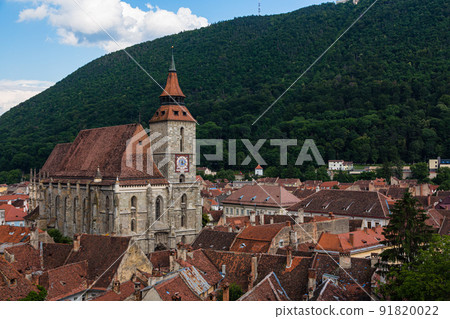 The cityscape of the old town, the black church and Mt. Tumpa seen from the black tower of Brasov in Transylvania, Romania 91820022
