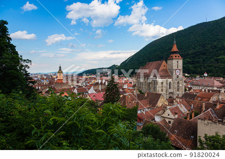 The cityscape of the old town, the black church and Mt. Tumpa seen from the black tower of Brasov in Transylvania, Romania The cityscape of the old town, the black church and Mt. Tumpa seen from the black tower of Brasov in Transylvania, Romania 91820024