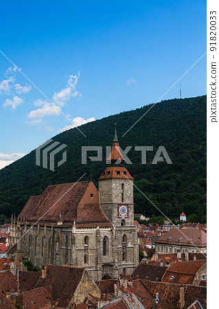 The cityscape of the old town, the black church and Mt. Tumpa seen from the black tower of Brasov in Transylvania, Romania The cityscape of the old town, the black church and Mt. Tumpa seen from the black tower of Brasov in Transylvania, Romania 91820033