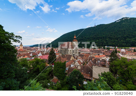 The cityscape of the old town, the black church and Mt. Tumpa seen from the black tower of Brasov in Transylvania, Romania The cityscape of the old town, the black church and Mt. Tumpa seen from the black tower of Brasov in Transylvania, Romania 91820040