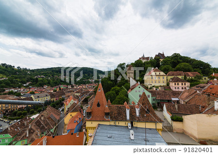 The mountain of the school seen from the observation deck of the clock tower in the historical district of Sighisoara in Transylvania, Romania 91820401