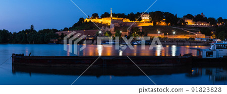 Illuminated Belgrade Fortress and Sava River in Belgrade seen from the opposite bank of Serbia 91823828