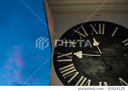 Illuminated clock tower at Petrovaradin Fortress in Novi Sad, Serbia 91824120