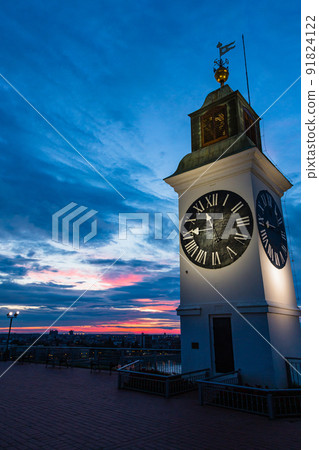 Illuminated clock tower at Petrovaradin Fortress in Novi Sad, Serbia 91824122