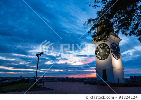 Illuminated clock tower at Petrovaradin Fortress in Novi Sad, Serbia 91824124