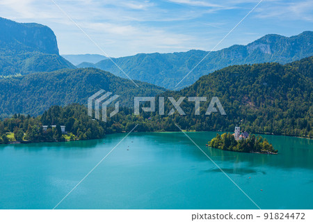 Bled Lake seen from Bled Castle in Slovenia, St. Mary's Church and Julia Alps on Bled Island Bled Lake seen from Bled Castle in Slovenia, St. Mary's Church and Julia Alps on Bled Island 91824472