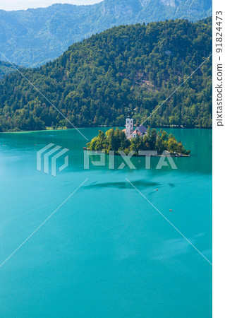 Bled Lake seen from Bled Castle in Slovenia, St. Mary's Church and Julia Alps on Bled Island Bled Lake seen from Bled Castle in Slovenia, St. Mary's Church and Julia Alps on Bled Island 91824473