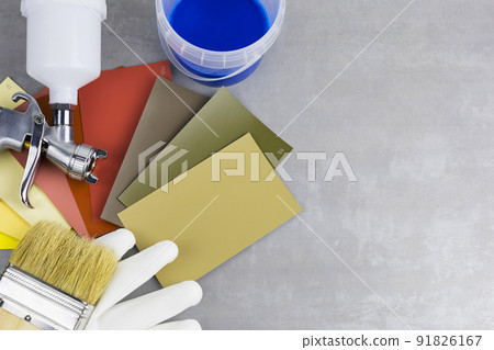 paint spray gun at work at the workplace in the workshop. paint spray gun at work at the workplace in the workshop. 91826167