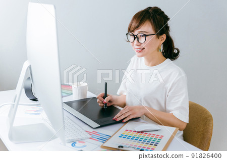 Japanese women (designers, illustrators, creators) doing creative work with pen tablets Japanese women (designers, illustrators, creators) doing creative work with pen tablets 91826400