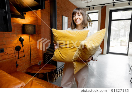 Portrait of a woman doing housework at modern house 91827185