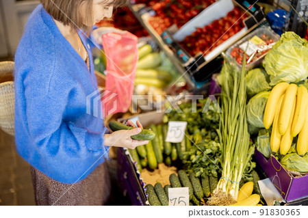 Woman shopping food at market 91830365