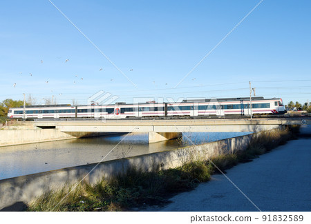 Train on railway. Speed train in motion on Valencia railroad. 91832589
