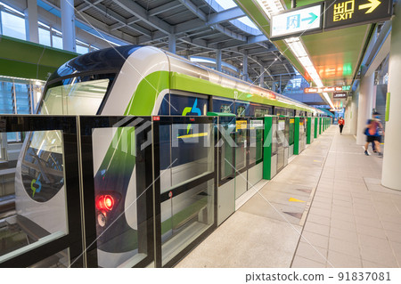 Taichung City, Taiwan - July 3, 2022 : Taichung MRT Metro system Green line train stop at the Shui-an Temple metro station platform screen doors. 91837081