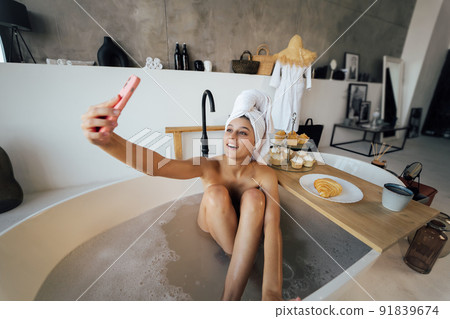 Brunette doing her sexy photo while taking bath Brunette doing her sexy photo while taking bath 91839674