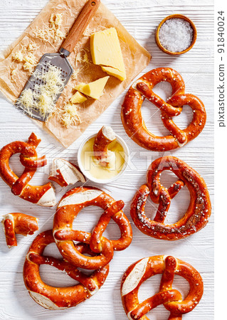 pretzels in the form of knot with cheese sauce pretzels in the form of knot with cheese sauce 91840024