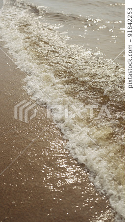 vertical shot of waves rolling on a beach on Baltic Sea vertical shot of waves rolling on a beach on Baltic Sea 91842253