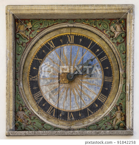 old wooden clock on the wall in Tallinn, estonia 91842258