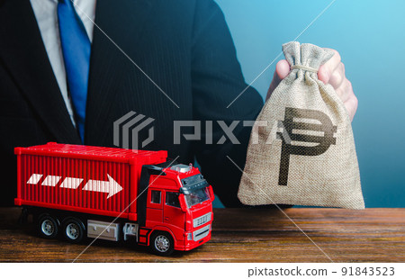 Businessman with philippine peso money bag and truck. Good salaries for drivers. Rising prices, global containers shortage crisis. High income of the transport business and the transport of goods. 91843523