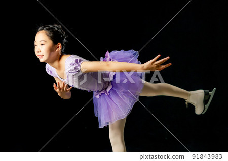 Girl skating figure skating spiral Girl skating figure skating spiral 91843983