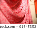 Isolated shots of freeze motion of red satin. 91845352