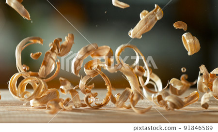Freeze motion of falling sawdust, macro shot. 91846589