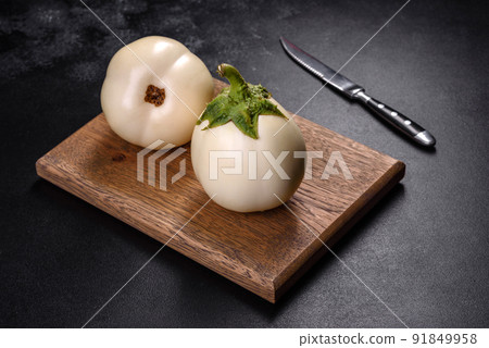 Fresh white eggplant ripped from the garden by the house 91849958