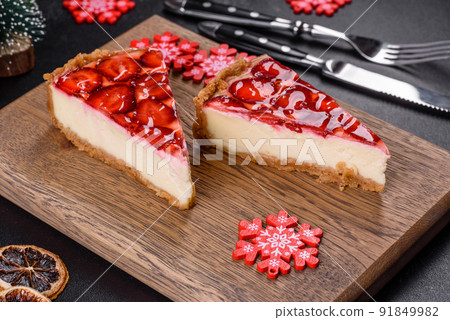 Delicious christmas strawberry tart on concrete background, top view, copy space Delicious christmas strawberry tart on concrete background, top view, copy space 91849982