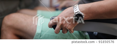 Male person seat in airplane and squeezes chair, scared to fly in sky Male person seat in airplane and squeezes chair, scared to fly in sky 91850576