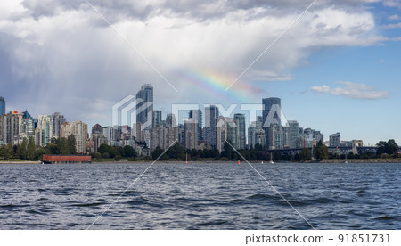 Downtown Vancouver City Skyline with clouds and rainbow. Downtown Vancouver City Skyline with clouds and rainbow. 91851731