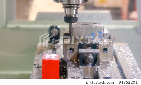 Metal drilling closeup in metal workshop with electric drill. Metal drilling closeup in metal workshop with electric drill. 91852201