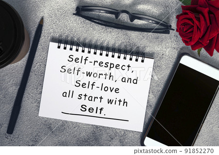 Motivational and inspirational quote on a note book on marble table. Motivational and inspirational quote on a note book on marble table. 91852270