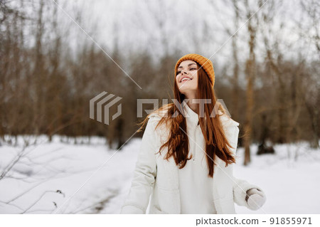 woman in winter clothes in a hat fun winter landscape fresh air woman in winter clothes in a hat fun winter landscape fresh air 91855971