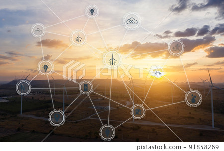 Aerial view of large wind turbines at sunrise taken from the air. wind turbines farm park. Save and green energy sustainable concept with virtual icons. 91858269