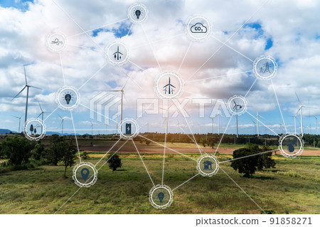 Aerial view of large wind turbines at sunrise taken from the air. wind turbines farm park. Save and green energy sustainable concept with virtual icons. 91858271