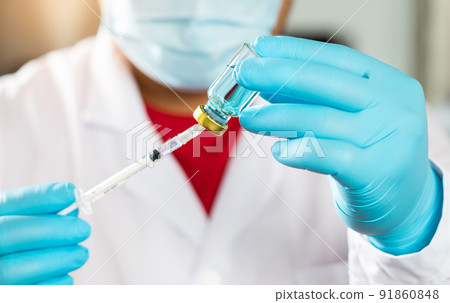 Covid-19 or coronavirus vaccine. Concept fight against virus covid-19 corona virus. Vaccine protect coronavirus outbreak. doctor or scientist in laboratory holding a syringe with liquid vaccines. 91860848