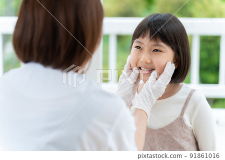 A girl undergoing a dental examination A girl undergoing a dental examination 91861016
