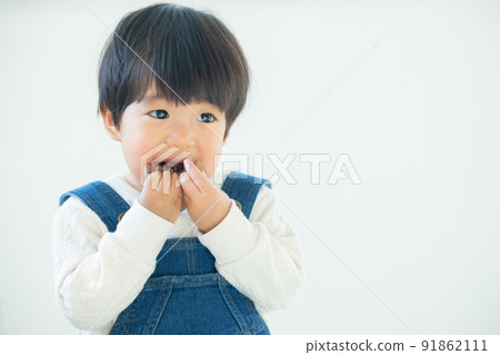 1 year old boy eating cookies 1 year old boy eating cookies 91862111